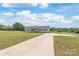 Long driveway leads to a well-maintained home with a spacious front yard at 3648 Plainfield Dr, Shelby, NC 28150