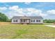 Charming ranch-style home with gray siding, black shutters, and a cozy front porch at 3648 Plainfield Dr, Shelby, NC 28150