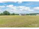 Sprawling green yard showcasing the home's front exterior under a beautiful blue sky at 3648 Plainfield Dr, Shelby, NC 28150