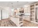 Bright kitchen with island, modern appliances, cabinets, and hanging lights at 3648 Plainfield Dr, Shelby, NC 28150