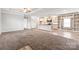 Spacious living room features a large area rug and leads into the open-concept kitchen at 3648 Plainfield Dr, Shelby, NC 28150