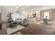 Open-concept living space with plush carpet, modern decor, and a view of the kitchen at 3648 Plainfield Dr, Shelby, NC 28150
