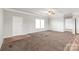 Large neutral toned living room with adjacent hallway and entrance at 3648 Plainfield Dr, Shelby, NC 28150