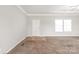 Neutral color scheme of the large living room with a carpeted area at 3648 Plainfield Dr, Shelby, NC 28150
