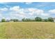 Expansive vacant land perfect for building your dream home or investment property with beautiful sky and surrounding trees at 3648 Plainfield Dr, Shelby, NC 28150
