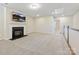 Spacious bonus room features a cozy fireplace and a mounted television for entertainment at 3813 Amalia Pl, Indian Land, SC 29707
