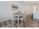 Cozy dining area featuring a round table, four chairs, and stylish decor at 3813 Amalia Pl, Indian Land, SC 29707