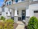 Welcoming front entrance with stone pillars and covered porch, showcasing the home's inviting facade at 3813 Amalia Pl, Indian Land, SC 29707