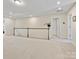Open hallway with neutral walls and carpeted floors, connecting different areas of the home at 3813 Amalia Pl, Indian Land, SC 29707