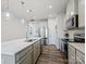 Bright kitchen featuring stainless steel appliances, a large island, and ample cabinet space at 3813 Amalia Pl, Indian Land, SC 29707