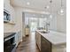 Spacious kitchen with stainless steel appliances, white cabinets, and a seamless flow into the living area at 3813 Amalia Pl, Indian Land, SC 29707