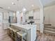 Modern kitchen featuring a large island, pendant lighting, stainless steel appliances, and white cabinetry at 3813 Amalia Pl, Indian Land, SC 29707