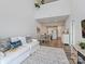 Open-concept living room with high ceilings seamlessly connects to a modern kitchen and dining area at 3813 Amalia Pl, Indian Land, SC 29707