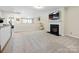 Spacious loft area with a fireplace and a window view at 3813 Amalia Pl, Indian Land, SC 29707