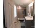 Bathroom features tile flooring, single sink vanity, tub with shower and a window at 412 E Broad St, Salisbury, NC 28144