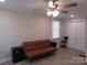 Bedroom with modern light fixtures, neutral wall color, and wood-look flooring at 412 E Broad St, Salisbury, NC 28144