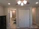 Bedroom with a view into the bathroom, a ceiling fan, closet and wood flooring at 412 E Broad St, Salisbury, NC 28144