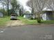 Home with front stairs and gravel driveway at 412 E Broad St, Salisbury, NC 28144