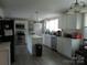 Bright kitchen with white cabinets, stainless steel appliances, and an island with modern finishes at 412 E Broad St, Salisbury, NC 28144