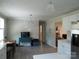 Bright open space featuring the kitchen, dinette and living room; note the white-painted brick fireplace at 412 E Broad St, Salisbury, NC 28144