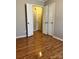 Cozy bedroom with laminate floors and two closet doors at 415 S Broad St, Gastonia, NC 28052