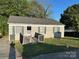 Charming single-story home with a well-maintained front yard and inviting walkway at 415 S Broad St, Gastonia, NC 28052