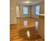 Bright living room featuring laminate floors and natural light at 415 S Broad St, Gastonia, NC 28052