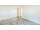 Bright bedroom features modern gray floors and neutral paint, with views to another room at 4336 Valeview Ln, Charlotte, NC 28269