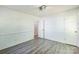 Inviting bedroom boasts vinyl flooring, wainscoting, and a well-placed doorway, creating a comfortable and stylish retreat at 4336 Valeview Ln, Charlotte, NC 28269
