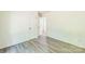 Bright bedroom with neutral walls, vinyl flooring, and a convenient doorway that adds depth and accessibility at 4336 Valeview Ln, Charlotte, NC 28269