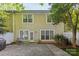 A backyard with a stone patio, ideal for outdoor living and entertaining at 4418 Coventry Row Ct, Charlotte, NC 28270