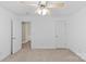Bright bedroom with neutral carpet, ceiling fan, and a window providing natural light at 4418 Coventry Row Ct, Charlotte, NC 28270