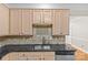 Functional kitchen showcasing a double basin sink, stainless steel appliances, and ample counter space at 4418 Coventry Row Ct, Charlotte, NC 28270