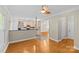 Open-concept living space with tile flooring and access to the kitchen with stainless appliances at 4418 Coventry Row Ct, Charlotte, NC 28270