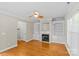 Inviting living room with hardwood floors, fireplace, and built-in shelving for storage and decor at 4418 Coventry Row Ct, Charlotte, NC 28270