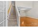 Bright living area showcasing high ceilings, hardwood floors, and staircase at 4418 Coventry Row Ct, Charlotte, NC 28270