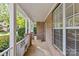 Covered porch featuring brick walls, white columns, and a view of neighborhood at 4418 Coventry Row Ct, Charlotte, NC 28270