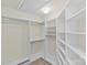 Walk-in closet with extensive custom shelving and ample storage space at 4418 Coventry Row Ct, Charlotte, NC 28270