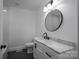 Modern bathroom with marble countertop vanity, black fixtures, and decorative elements at 4979 Plateau Rd, Vale, NC 28168