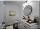 Modern bathroom with marble countertop vanity, black fixtures, and decorative elements at 4979 Plateau Rd, Vale, NC 28168