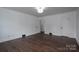 Spacious bedroom with hardwood floors, white walls, and ample natural light at 4979 Plateau Rd, Vale, NC 28168
