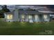 Inviting home exterior featuring a brick facade, covered front porch, and well-maintained landscaping at 4979 Plateau Rd, Vale, NC 28168