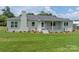 Charming single-story home with a brick exterior, a front porch, and a well-manicured lawn at 4979 Plateau Rd, Vale, NC 28168