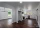 Bright open kitchen with stainless steel appliances and shaker style cabinets at 4979 Plateau Rd, Vale, NC 28168