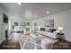 Staged living room with stylish furniture, fireplace, hardwood floors, and an abundance of natural light at 4979 Plateau Rd, Vale, NC 28168