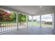 Spacious covered patio with a view of beautiful blooming trees and an outdoor greenery area at 4979 Plateau Rd, Vale, NC 28168