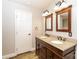 Modern bathroom features double sink vanity with granite countertop and wooden framed mirrors at 4989 Post Oak Ln, Rock Hill, SC 29732