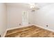 Bright, airy bedroom features sleek wood flooring, a large window, and neutral wall color at 4989 Post Oak Ln, Rock Hill, SC 29732