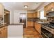 Well-equipped kitchen features stainless appliances, granite counters, and attractive tile backsplash at 4989 Post Oak Ln, Rock Hill, SC 29732