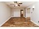 Open-concept living room with sleek wood flooring, decorative fireplace and neutral wall color at 4989 Post Oak Ln, Rock Hill, SC 29732